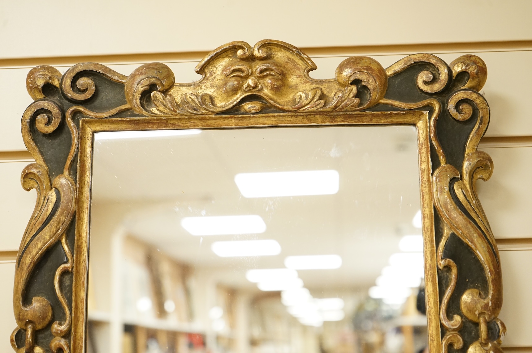 A 19th century parcel-gilt mirror, 53cm high